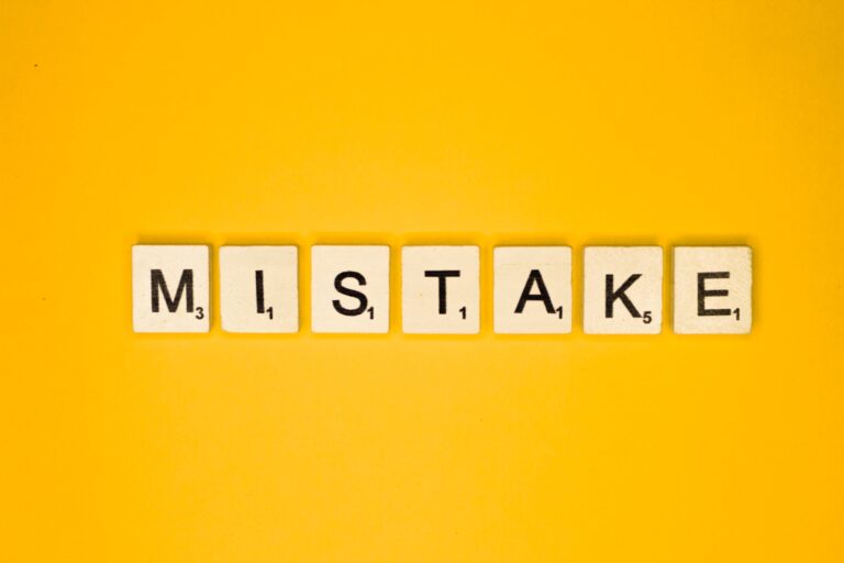 Mistake scrabble letters word on a yellow background